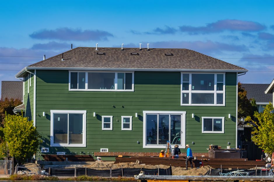 A house exterior with windows set in the wall