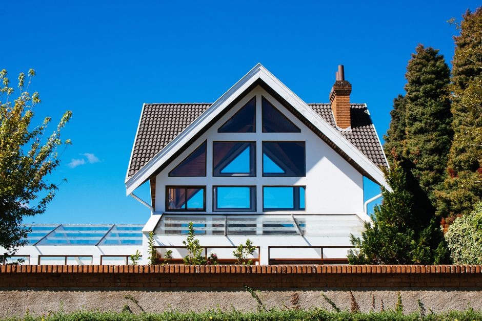 A house exterior with windows set in the wall