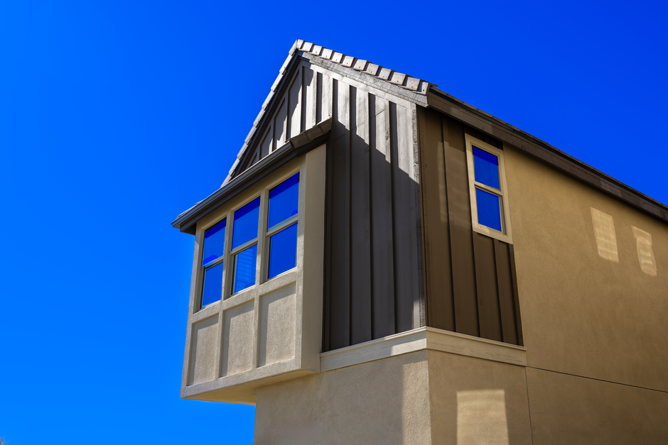 Windows in the wall of a house, seen from outside