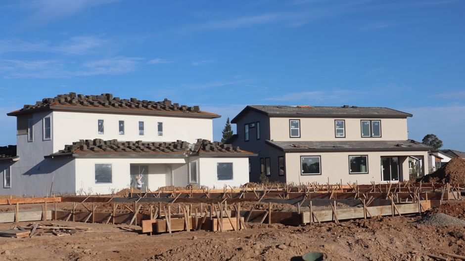 A house exterior with windows set in the wall