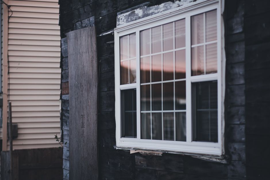 Windows in the wall of a house, seen from outside